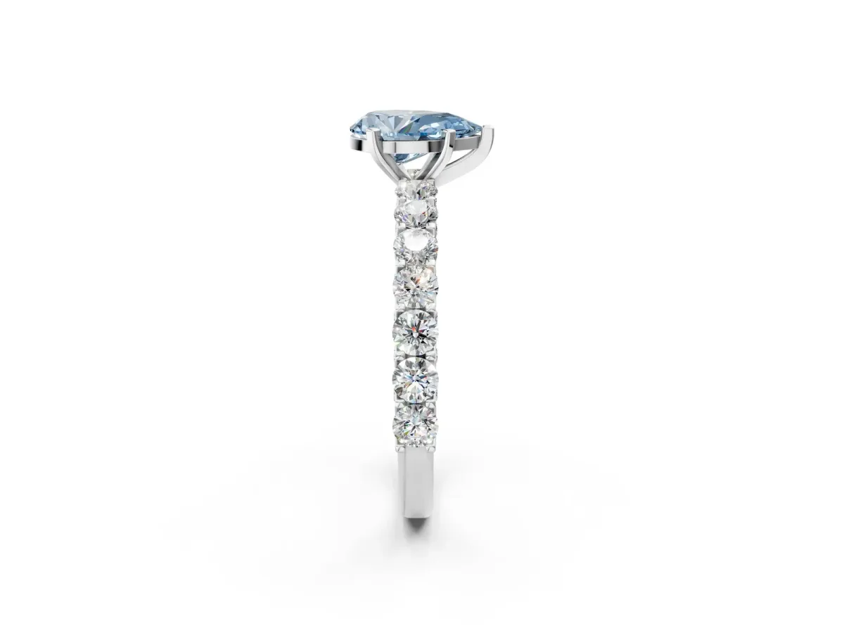 Fancy Blue Pear Cut Diamond Solitaire Ring with Shared Prong Pavé Band and Four-Prong Setting Silver