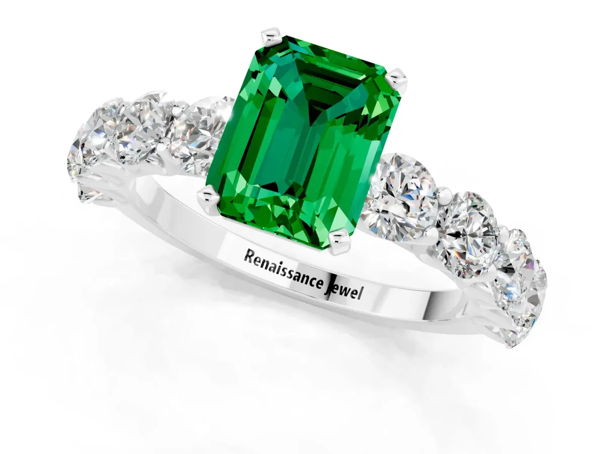 Emerald Cut Emerald Prong Setting with Side Stones on a Pave Band Platinum