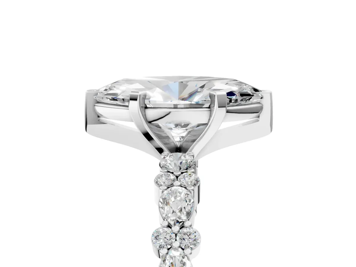 Marquise Cut Diamond Side Stone Solitaire Ring with Round and Four-Prong Setting Platinum