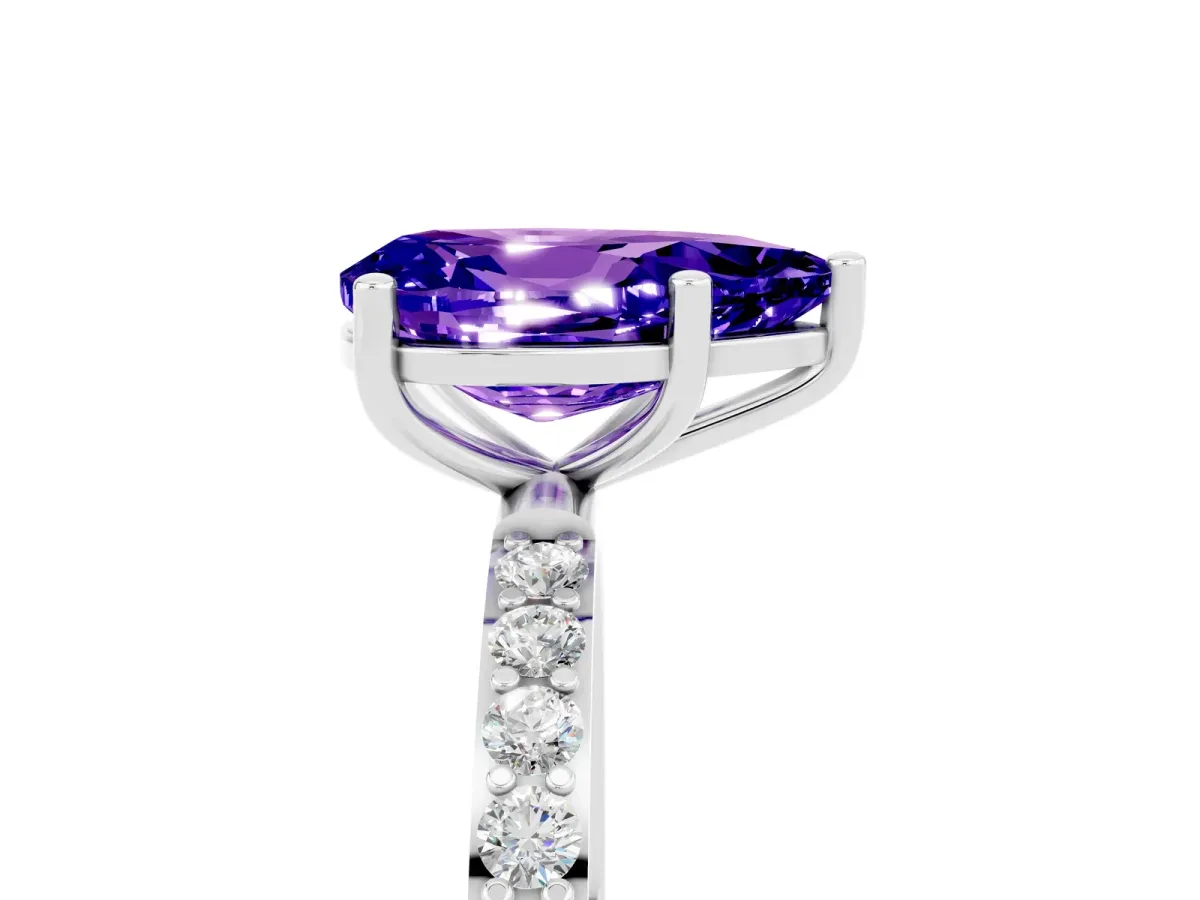 Pear Cut Tanzanite Solitaire Ring with Round Pavé Band and Prong Setting Silver