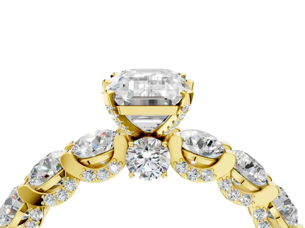 Emerald Cut Diamond Side Stone Engagement Ring with Four-Prong Setting Yellow gold