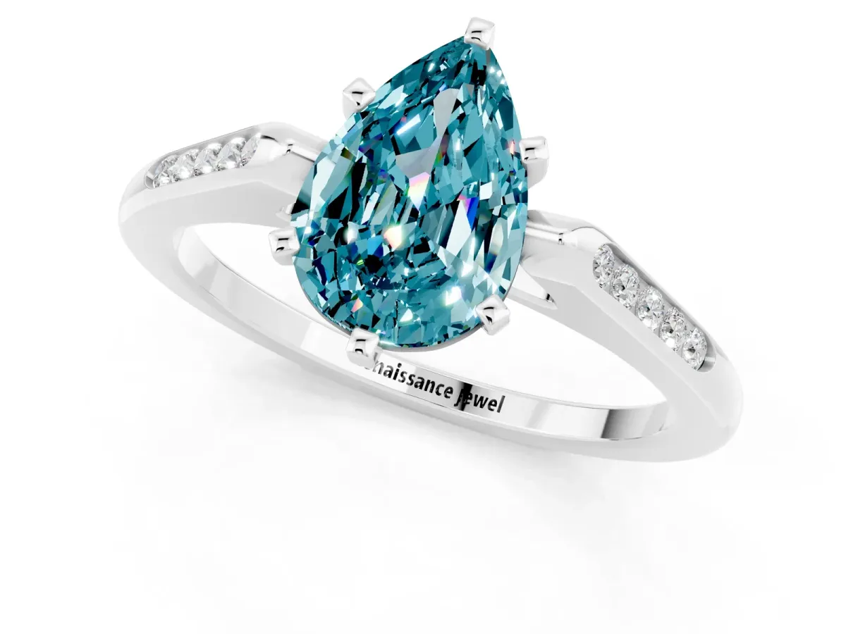 Pear Cut Blue Topaz Solitaire Ring with Channel Set Round Band and Prong Setting Silver