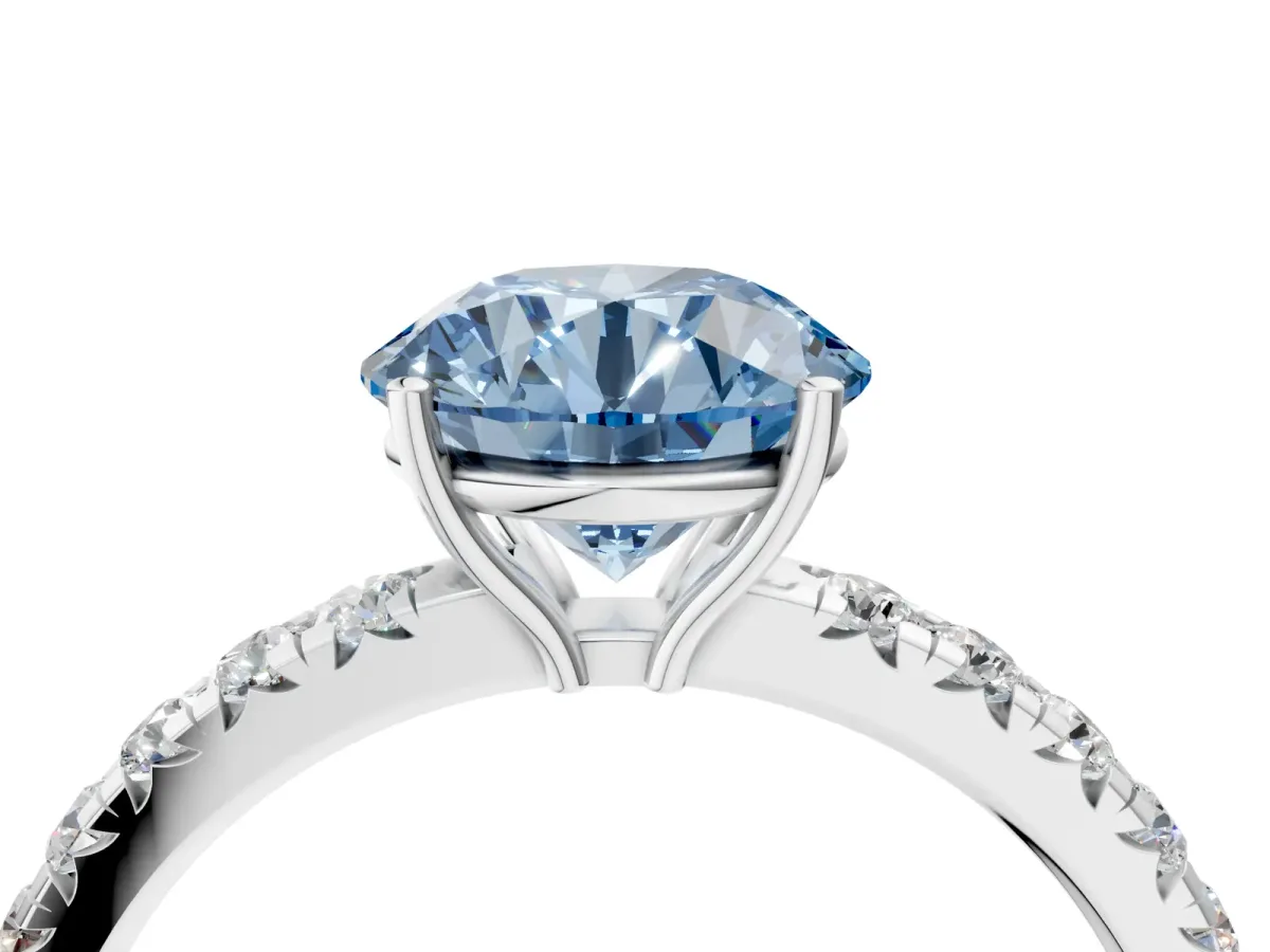 Fancy Blue Round Cut Diamond Pavé Solitaire Engagement Ring with Four-Prong Setting Silver