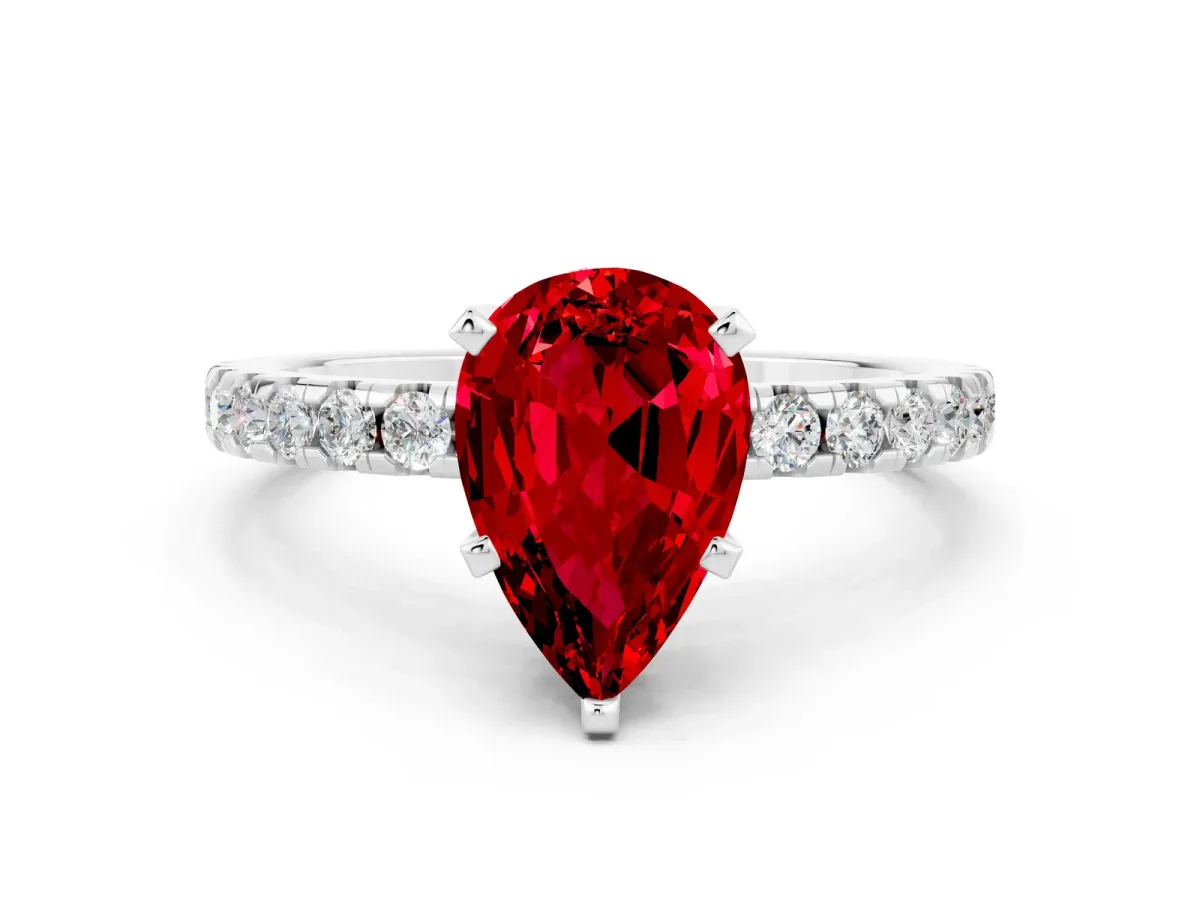 Pear Cut Ruby Solitaire Ring with Round Pavé Band and Four-Prong Setting Silver