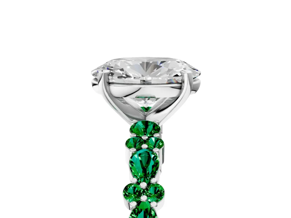 Oval Cut Diamond Side Stone Solitaire Ring with Round Emerald and Four-Prong Setting White gold
