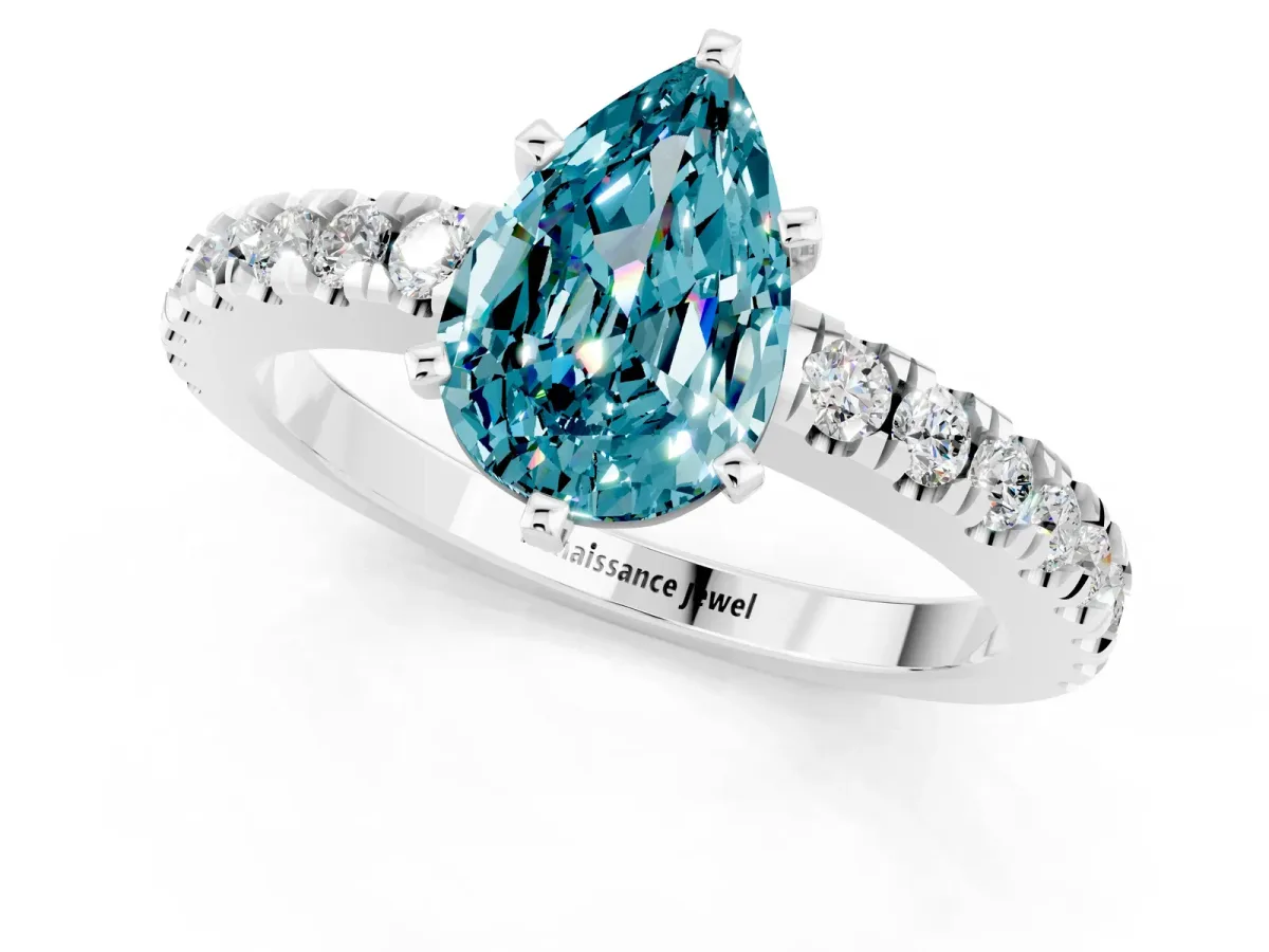 Pear Cut Solitaire Blue Topaz with Pavé Band and Four-Prong Setting Silver