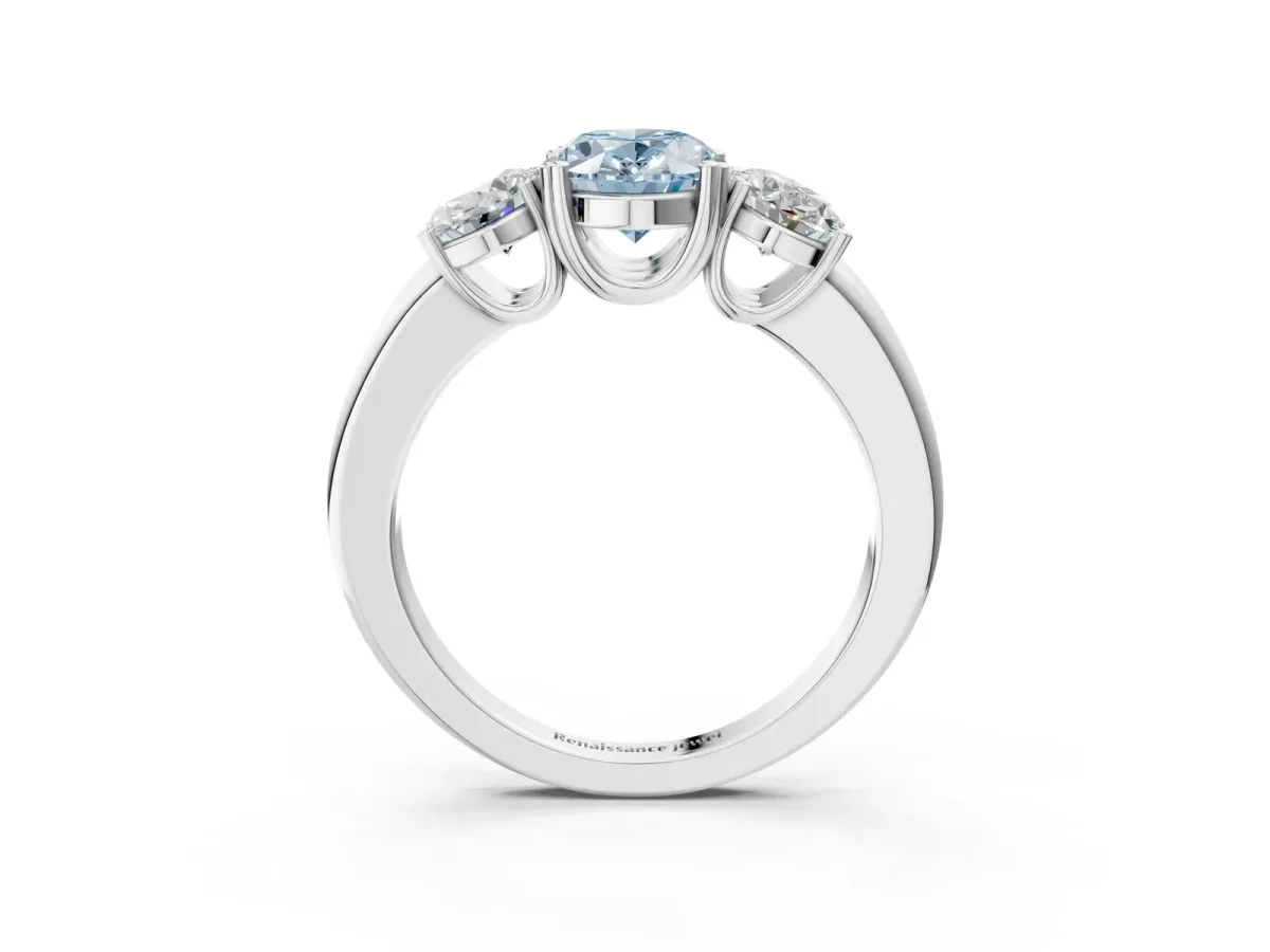 Fancy Blue Three-Stone Oval Cut Cut Diamond Ring with Channel Set Band and Four-Prong Setting Silver