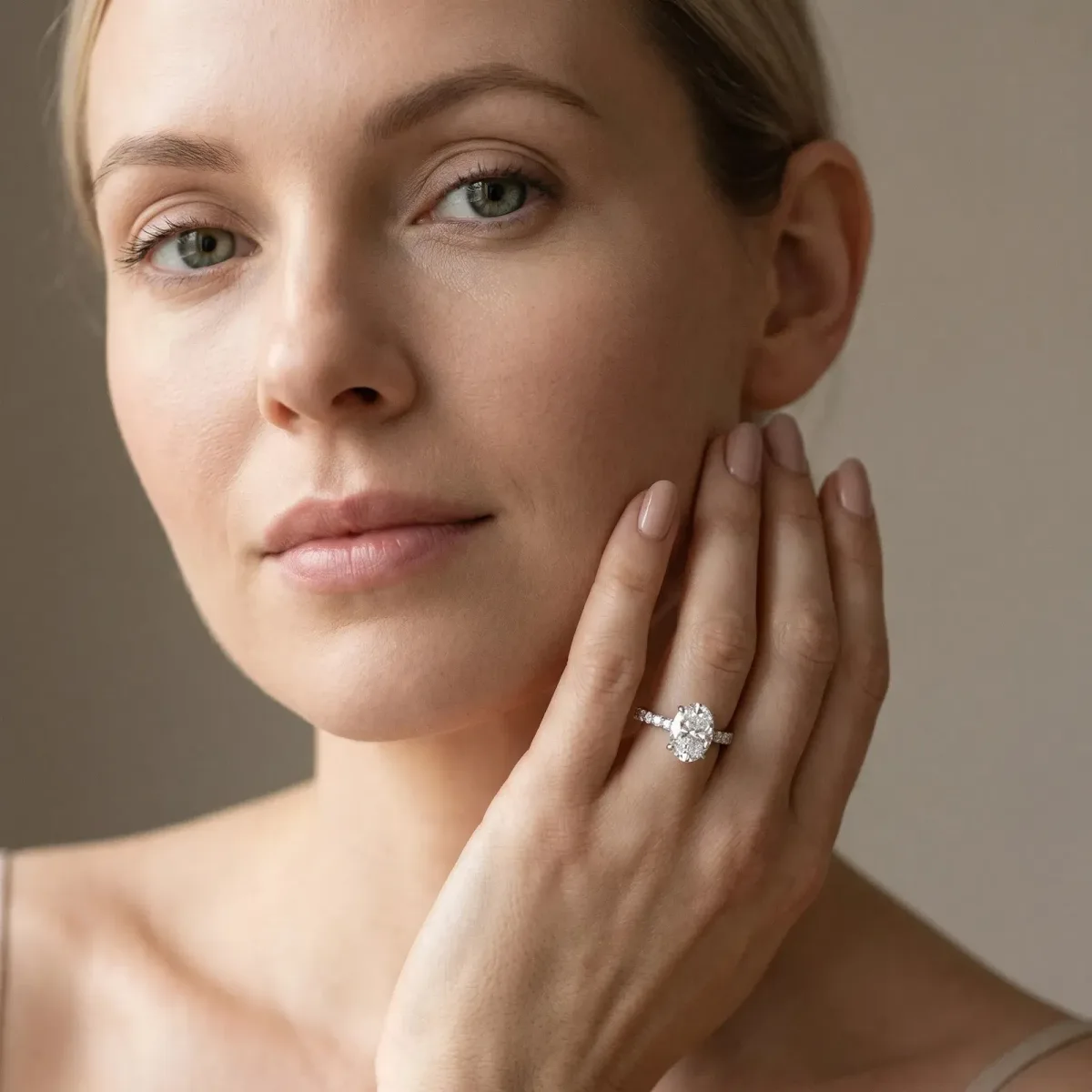 Oval Cut Diamond Solitaire Ring with Round Pavé Band and Four-Prong Setting Platinum