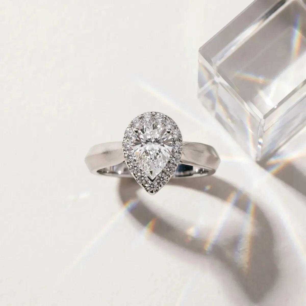 Halo Pear Cut Cut Solitaire Diamond Ring with Prong Setting Platinum