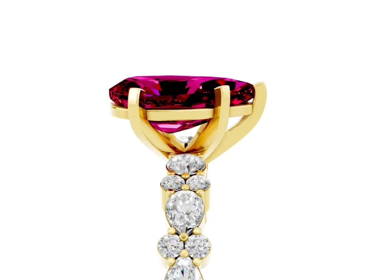 Pear Cut Garnet Side Stone Solitaire Ring with Round and Four-Prong Setting Yellow gold