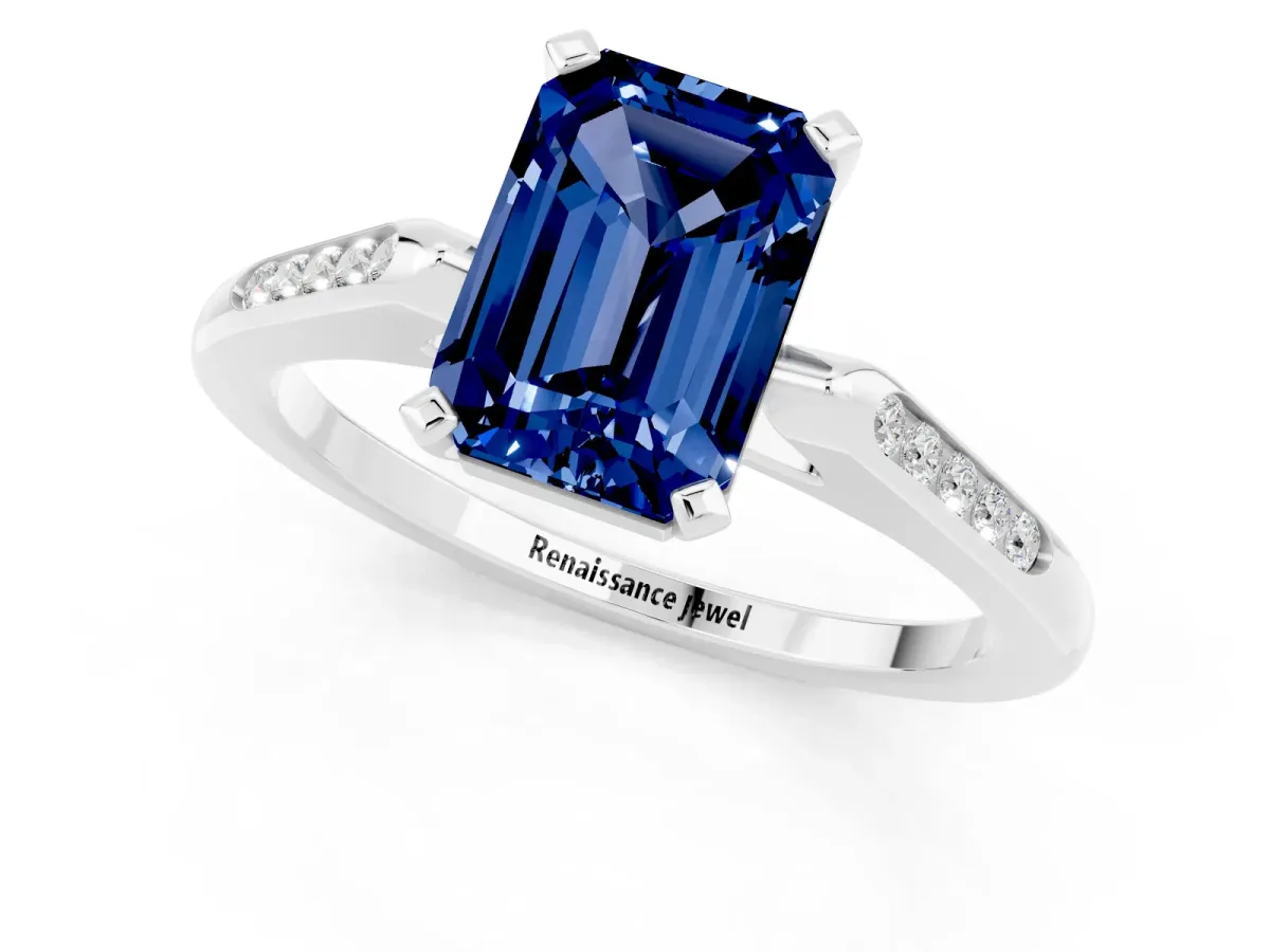 Emerald Cut Blue Sapphire Solitaire Ring with Channel Set Round Band and Prong Setting Silver