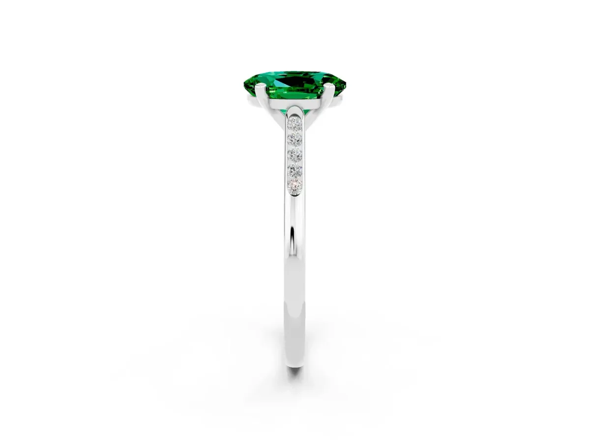 Oval Cut Emerald Solitaire Ring with Channel Set Round Band and Prong Setting White gold