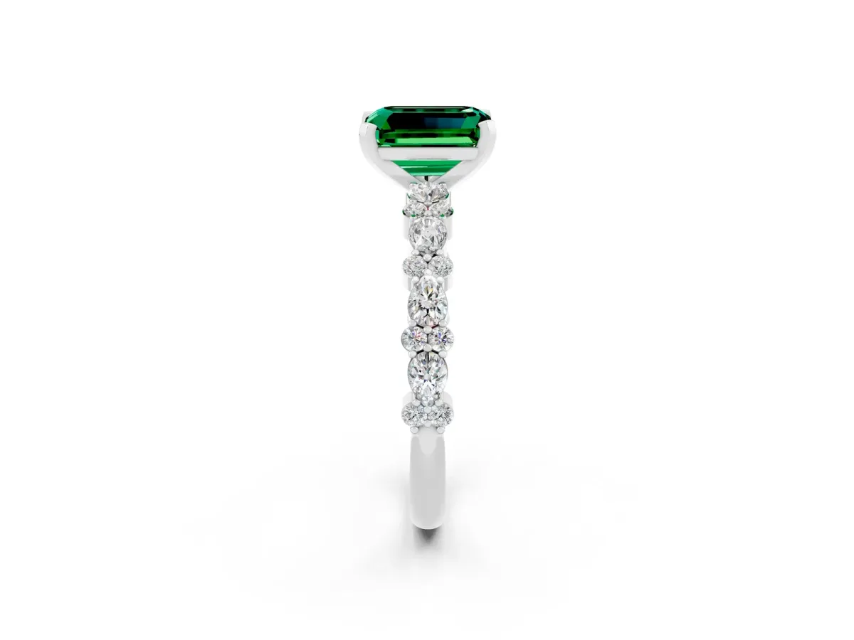 Emerald Cut Emerald Side Stone Solitaire Ring with Round and Four-Prong Setting Silver
