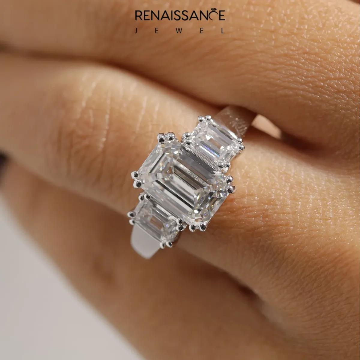 Three-Stone Oval Cut Cut Diamond Ring with Channel Set Band and Four-Prong Setting Silver