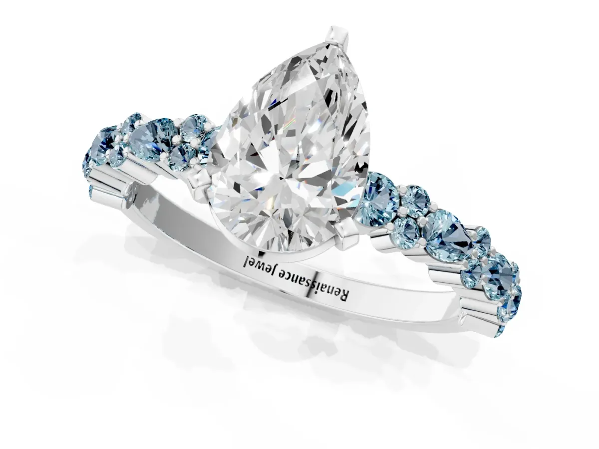 Pear Cut Diamond Side Stone Solitaire Ring with Round Aquamarine and Four-Prong Setting Silver