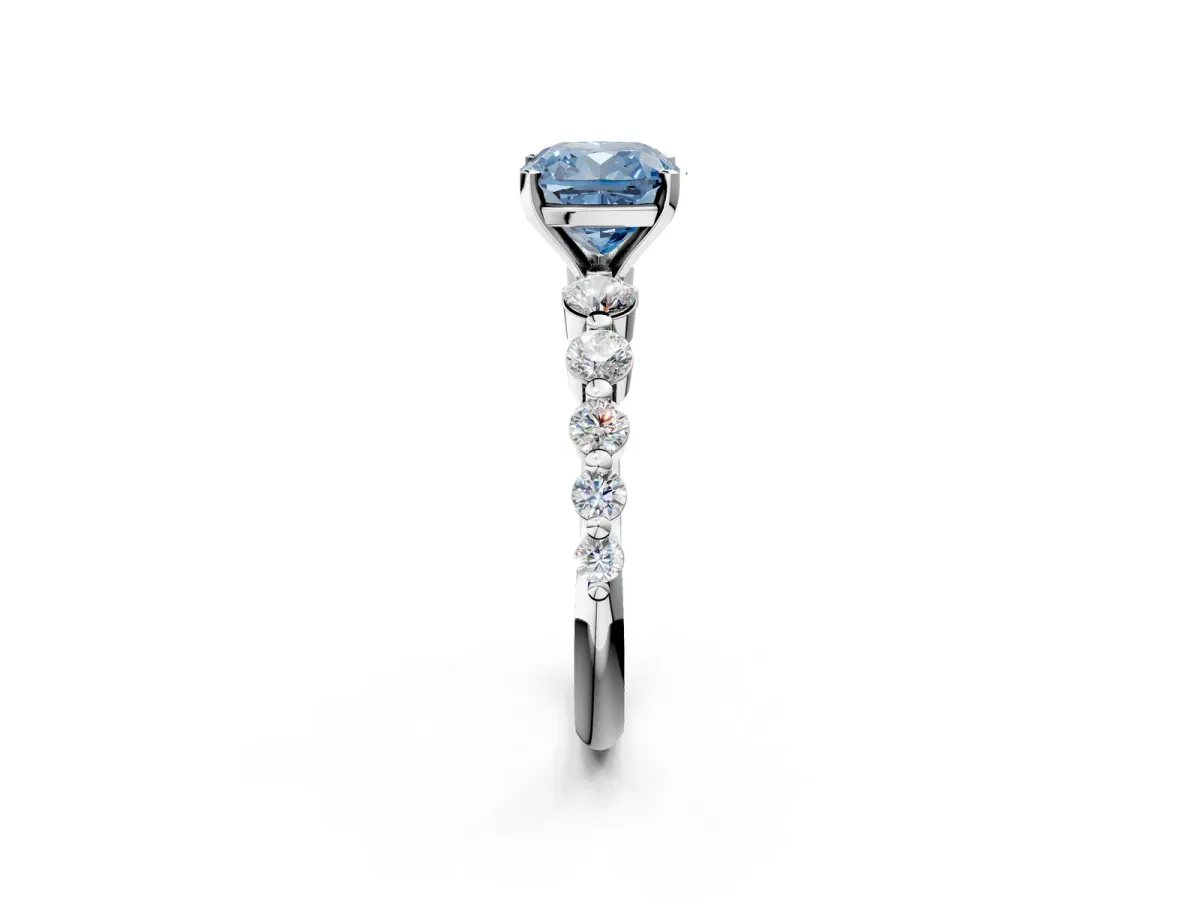 Fancy Blue Cushion Cut Solitaire Diamond Ring with Pave Band and Four-Prong Setting Silver