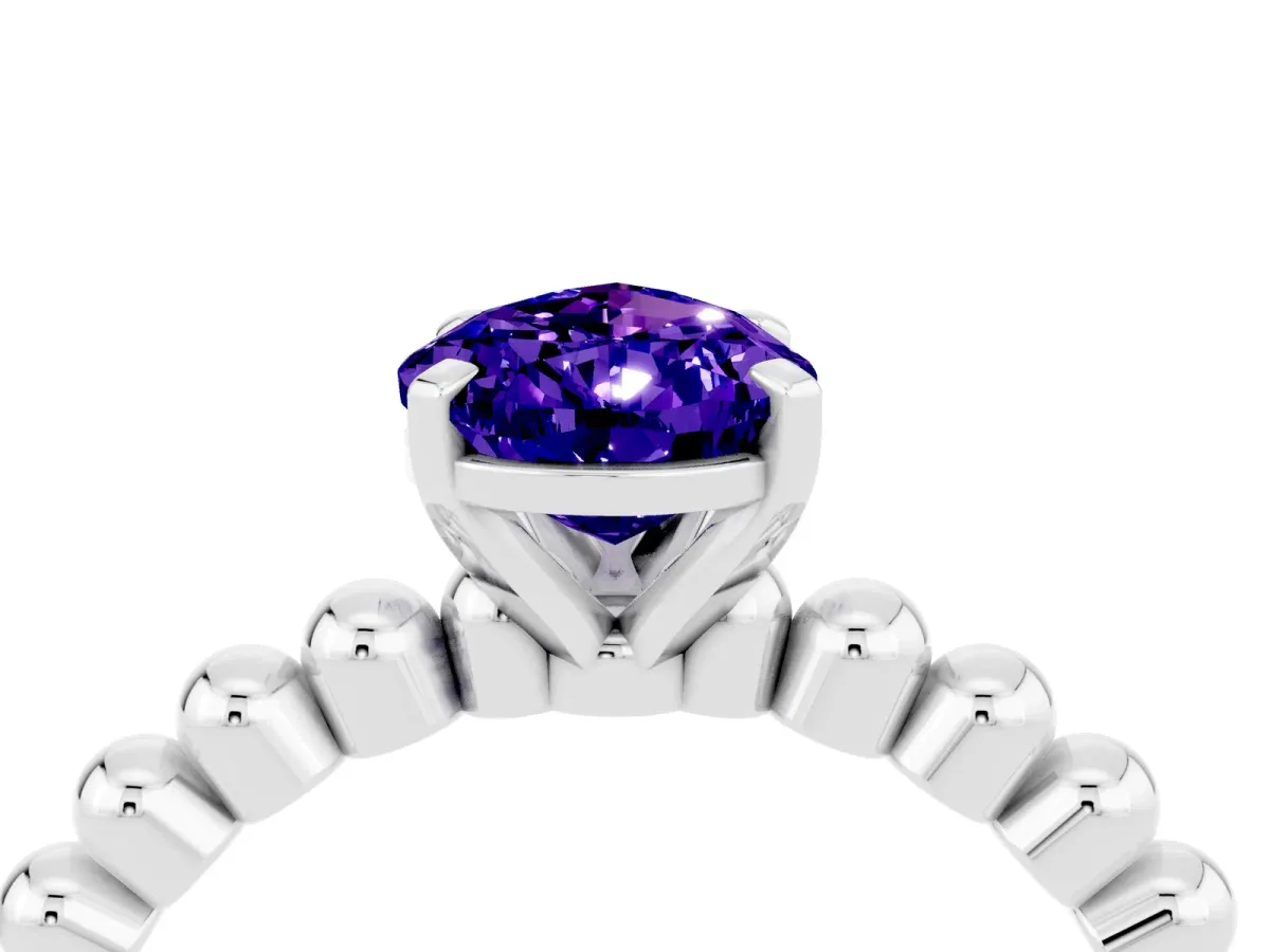 Pear Cut Tanzanite Solitaire Ring with Beaded Band and Prong Setting Silver
