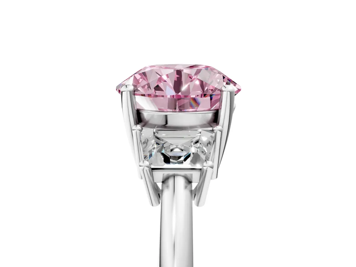 Fancy Pink Round Cut Diamond Three-Stone Ring with Trapezoid Side Stones and Prong Setting Platinum