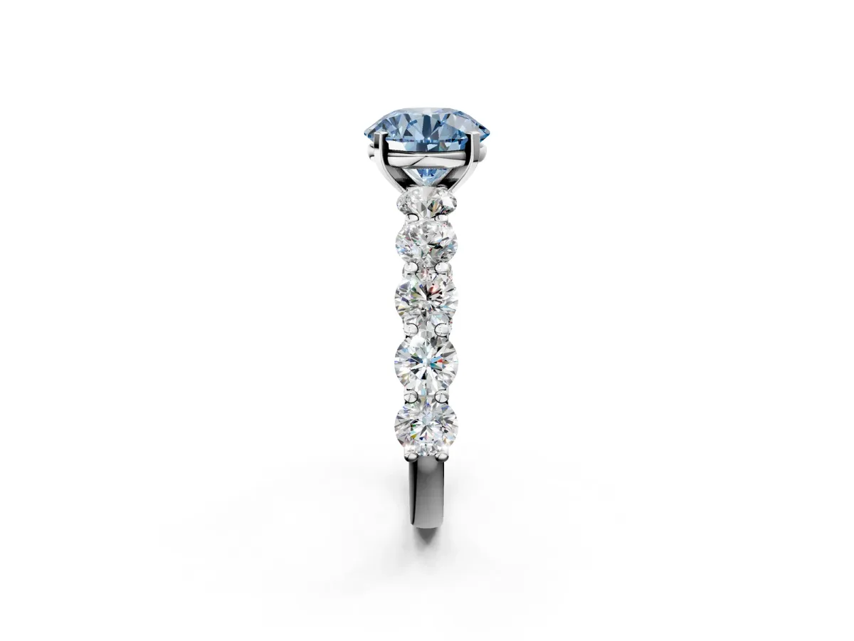 Fancy Blue Round Cut Diamond Prong Setting with Side Stones on a Pave Band Silver
