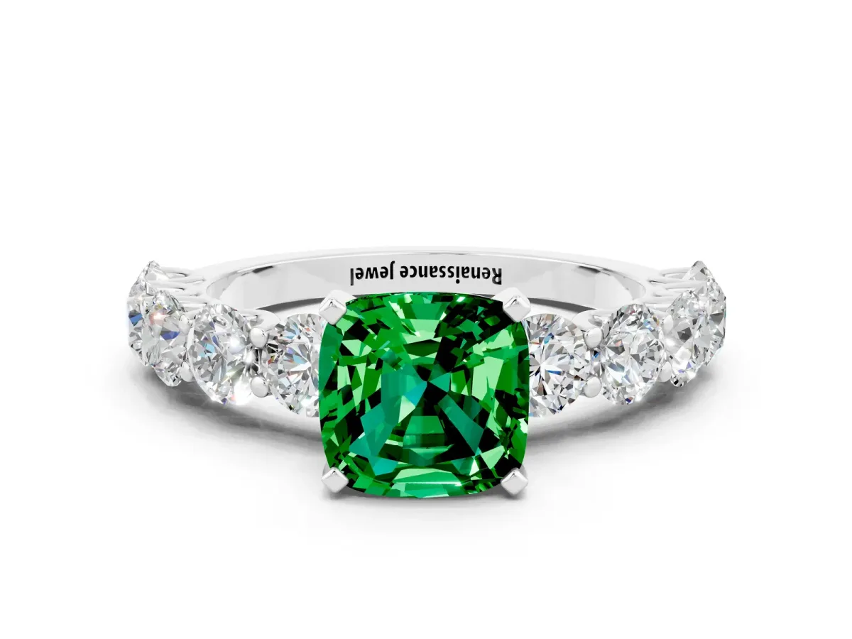 Cushion Cut Emerald Prong Setting with Side Stones on a Pave Band Platinum