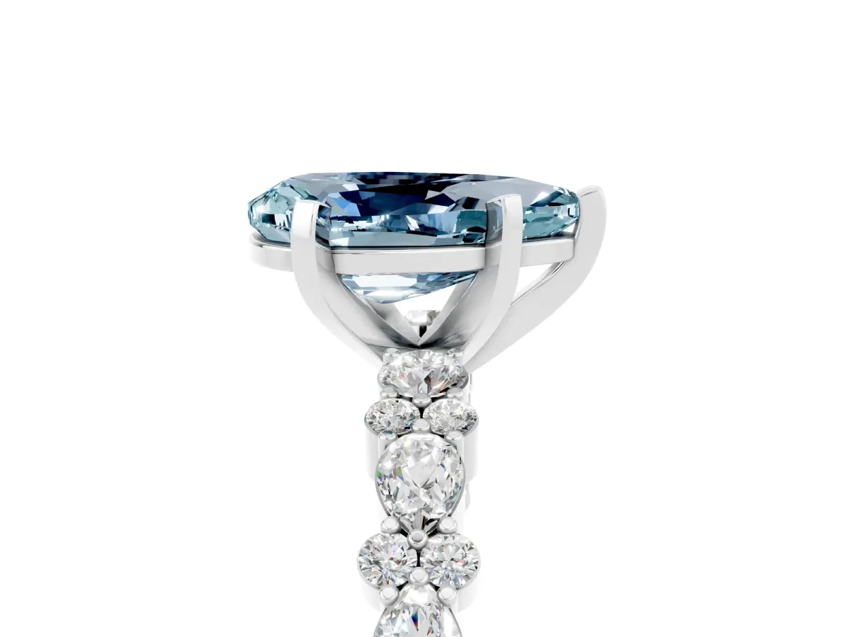 Pear Cut Aquamarine Side Stone Solitaire Ring with Round and Four-Prong Setting Silver