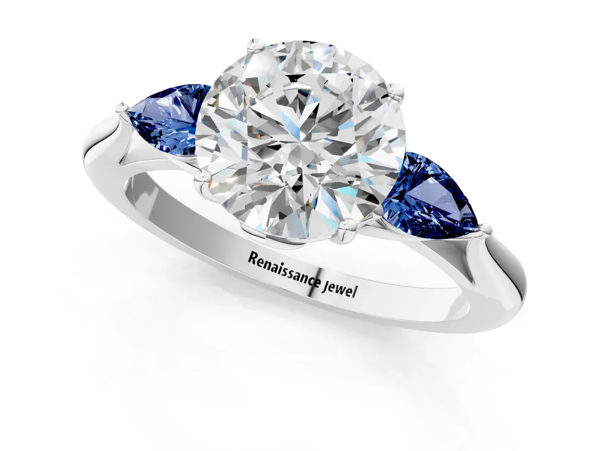 Round Cut Diamond Three-Stone Ring with Pear Blue Sapphire Side Stones and Prong Setting Silver