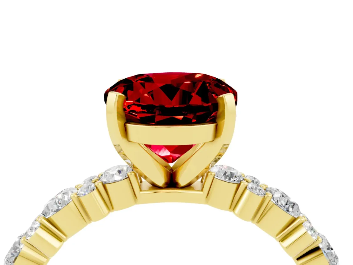 Round Cut Ruby Side Stone Solitaire Ring with Round and Four-Prong Setting Yellow gold