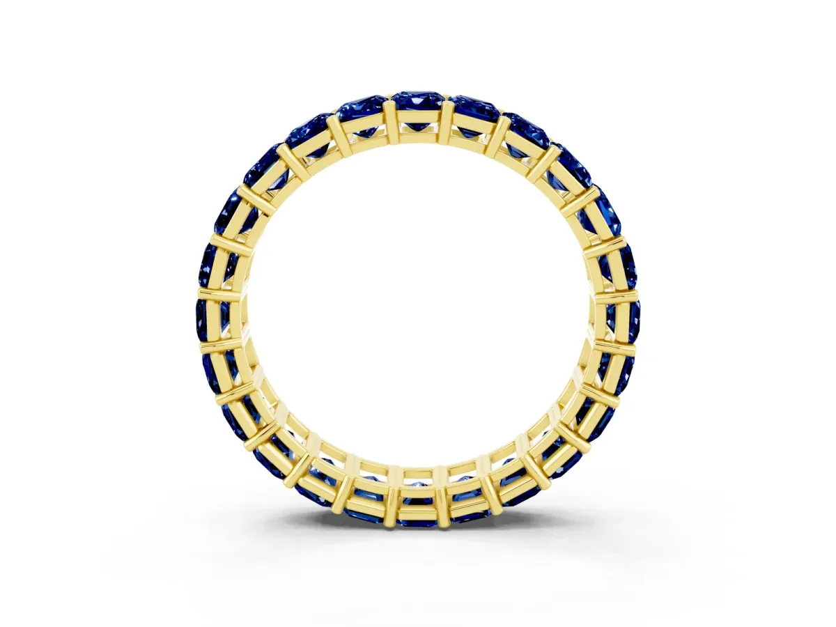 Emerald Cut Blue Sapphire Eternity Band with Shared Prong Setting Yellow gold