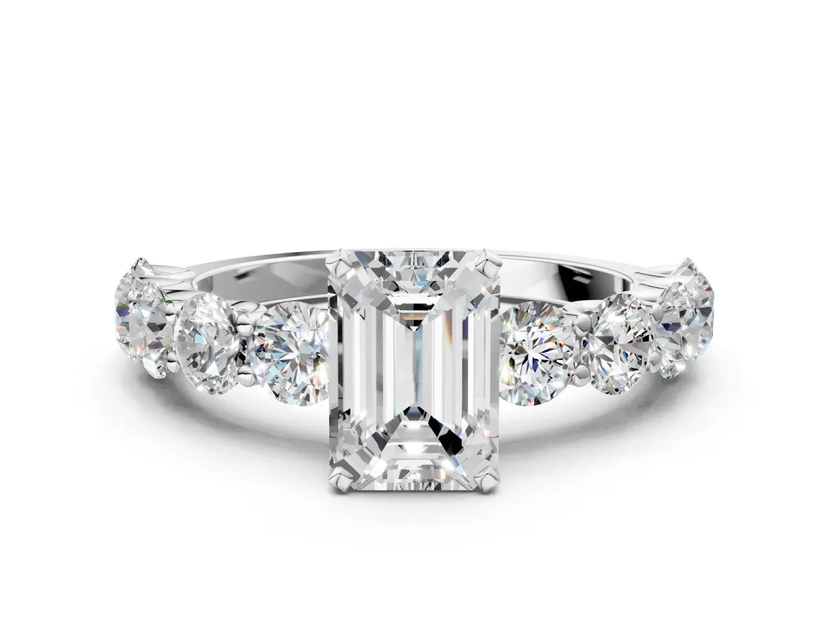 Emerald Cut Diamond Prong Setting with Side Stones on a Pave Band Silver