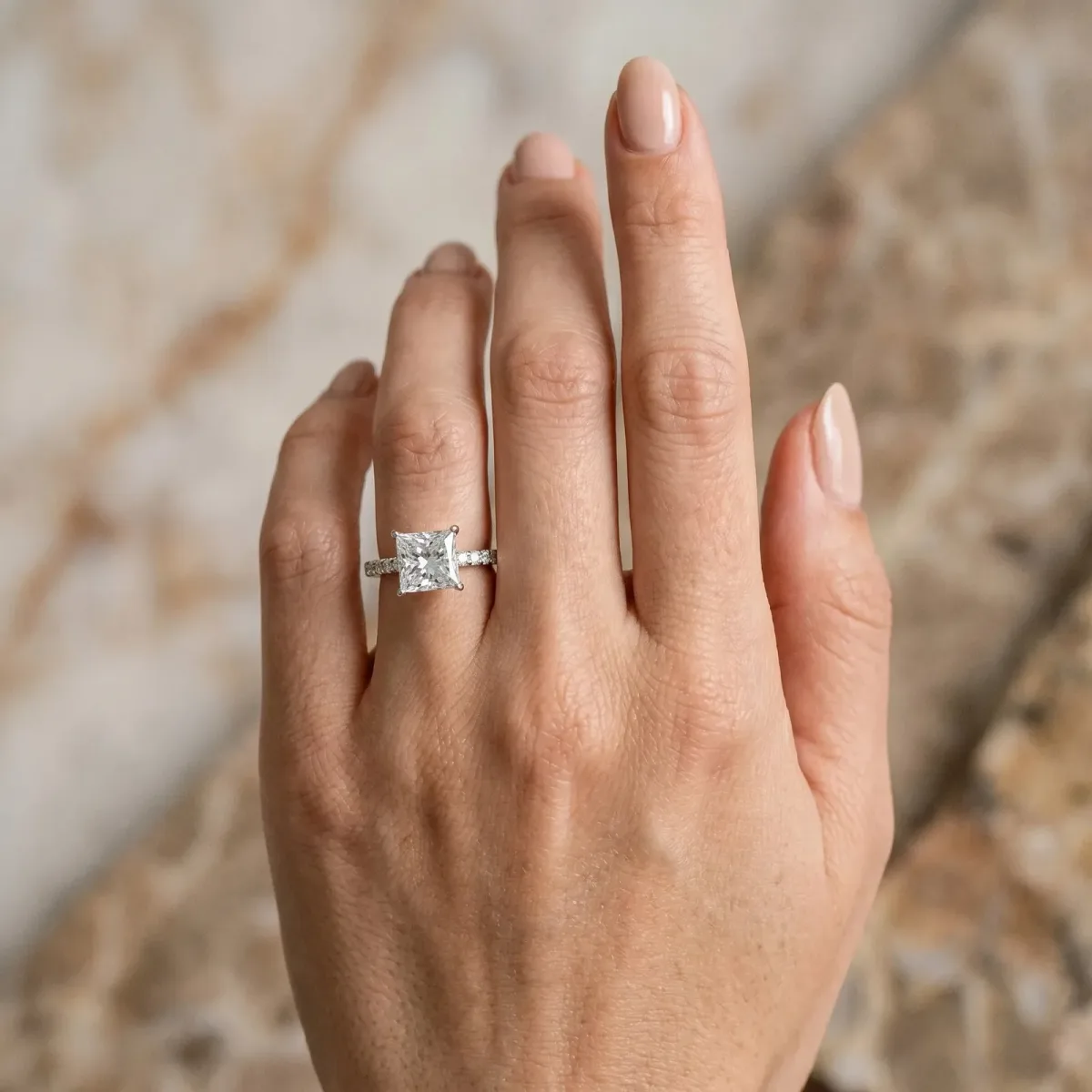 Princess Cut Diamond Solitaire Ring with Round Pavé Band and Four-Prong Setting Silver