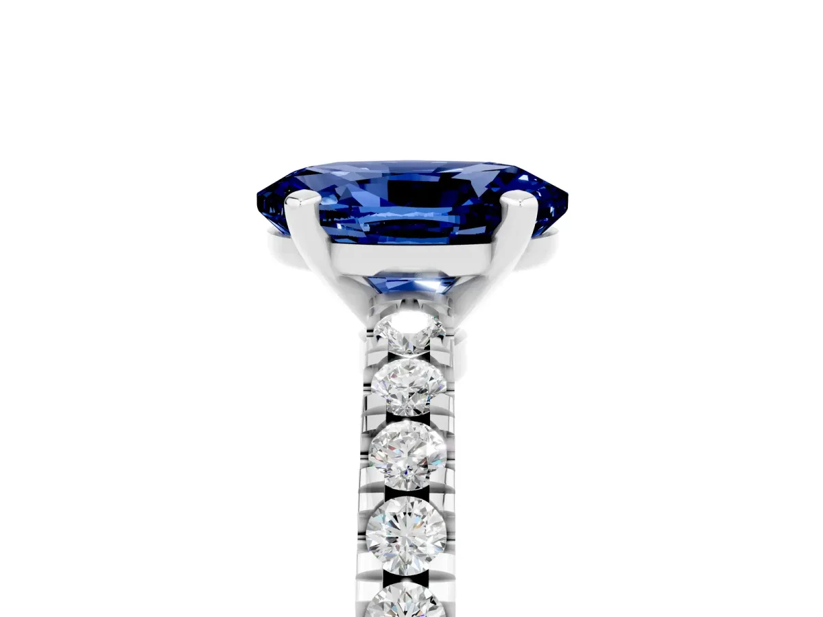 Oval Cut Solitaire Blue Sapphire with Pavé Band and Four-Prong Setting Silver