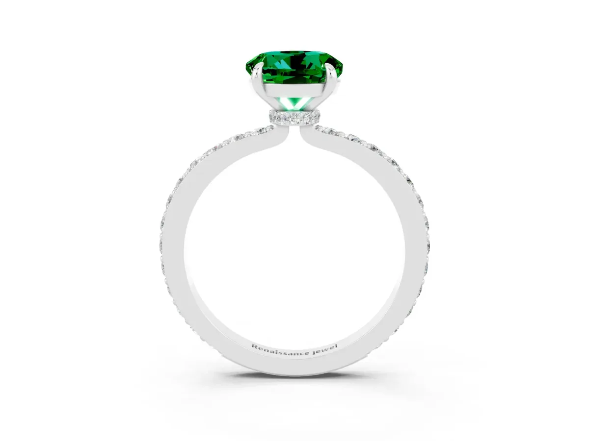 Round Cut Emerald Solitaire Engagement Ring with Pavé Band and Four-Prong Setting Silver