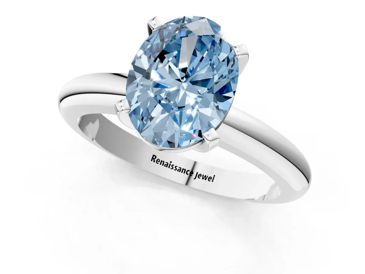 Fancy Blue Oval Cut Diamond Solitaire Engagement Ring with Round Band and Four-Prong Setting Silver