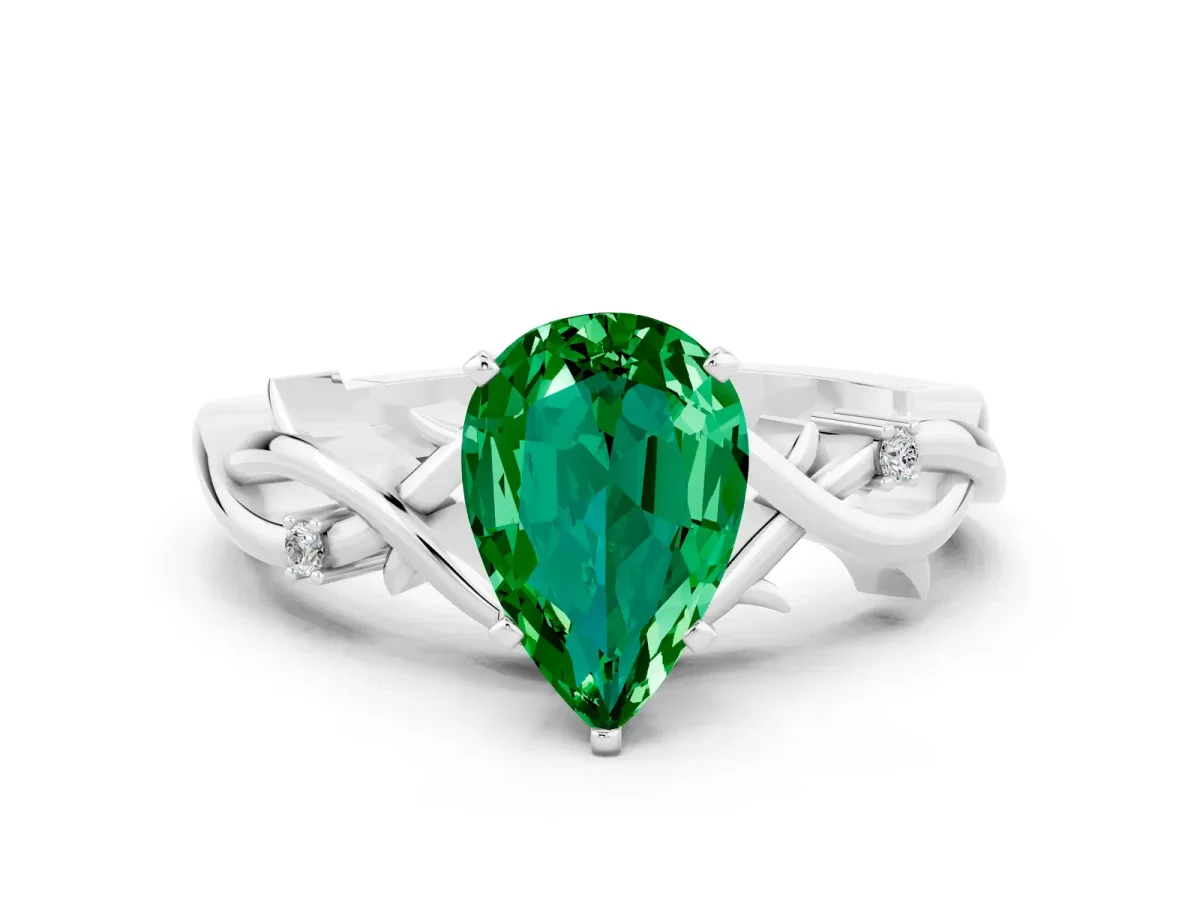 Pear Cut Emerald Solitaire Ring with Twisted Band and Prong Setting Silver