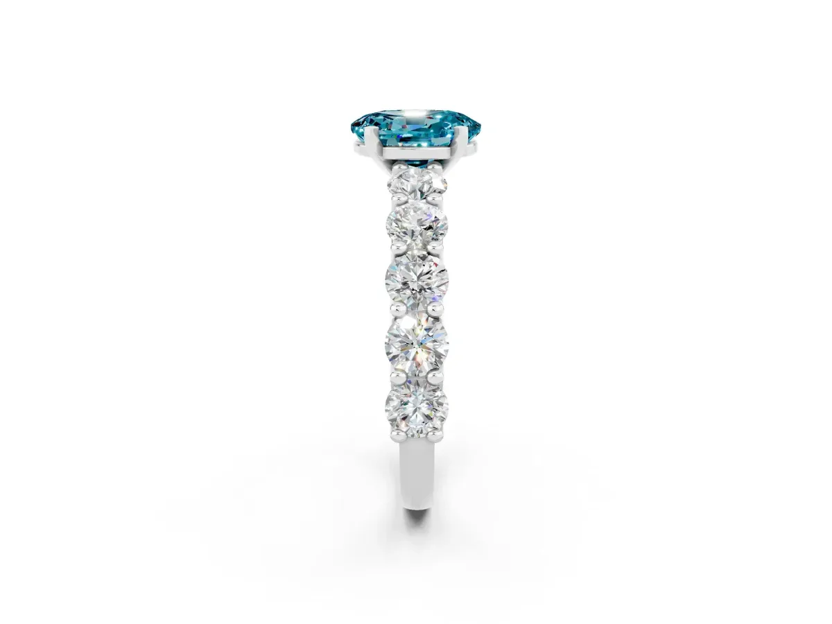 Oval Cut Blue Topaz Prong Setting with Side Stones on a Pave Band Silver