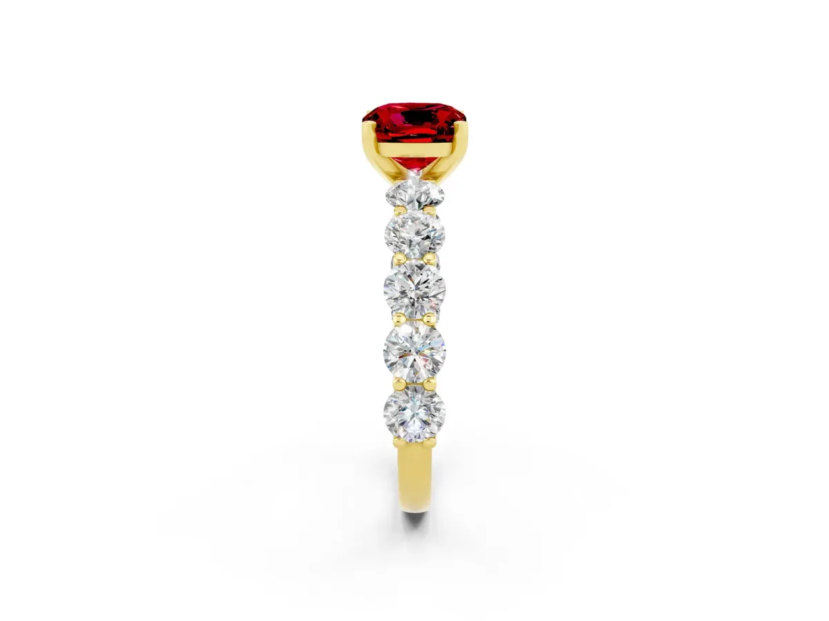 Cushion Cut Ruby Prong Setting with Side Stones on a Pave Band Yellow gold