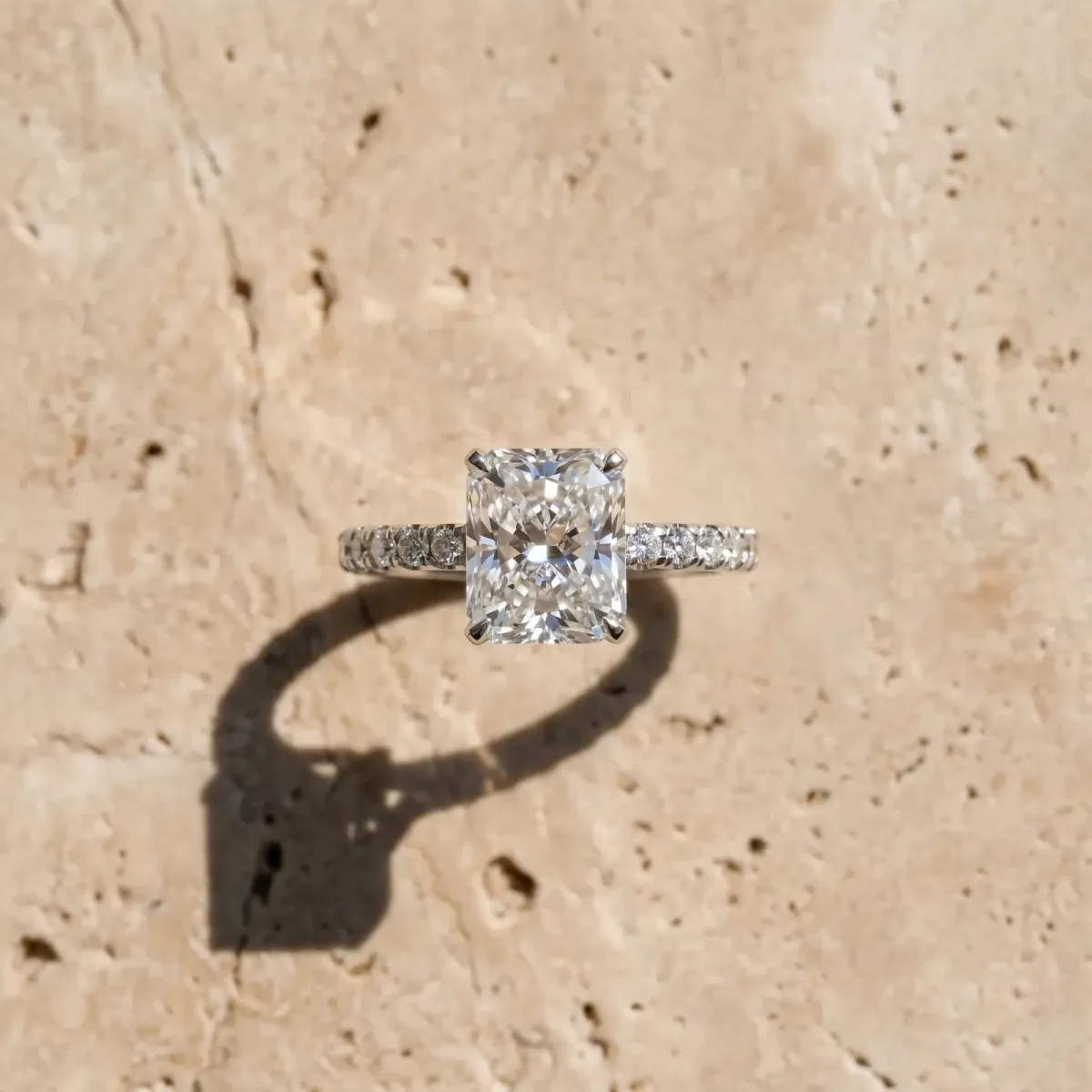 Radiant Cut Diamond Solitaire Ring with Round Pavé Band and Four-Prong Setting Silver