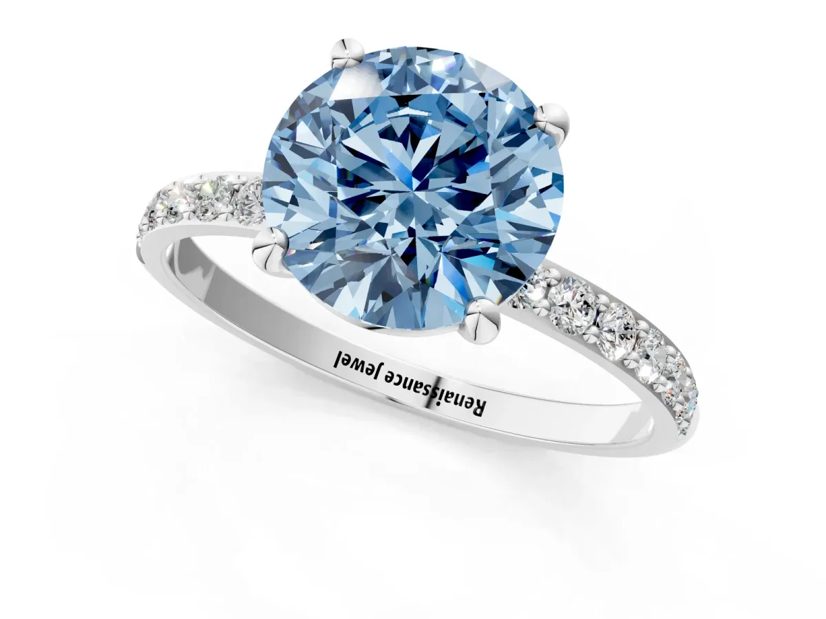 Fancy Blue Round Cut Diamond Solitaire Ring with Round Pavé Band and Prong Setting Silver