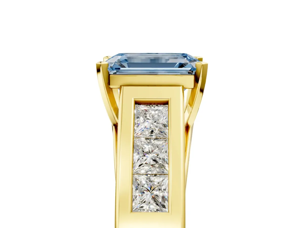Fancy Blue Emerald Cut Cut Channel Set Solitaire Ring with Four-Prong Setting Yellow gold
