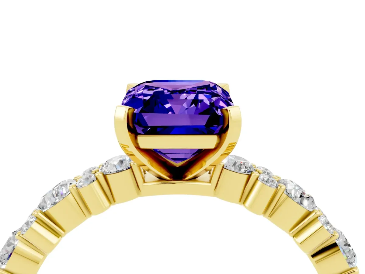 Emerald Cut Tanzanite Side Stone Solitaire Ring with Round and Four-Prong Setting Yellow gold
