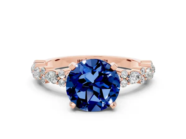Round Cut Blue Sapphire Side Stone Solitaire Ring with Round and Four-Prong Setting Rose gold