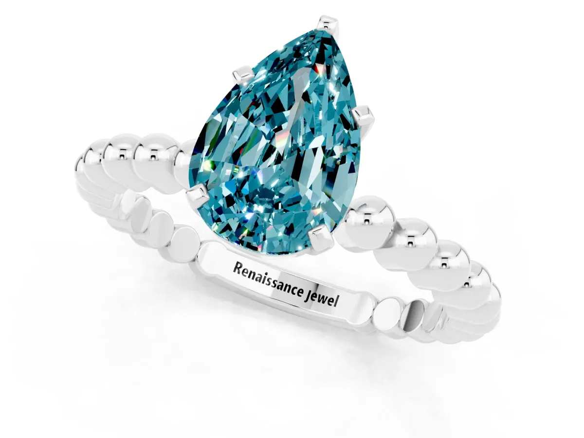 Pear Cut Blue Topaz Solitaire Ring with Beaded Band and Prong Setting Silver