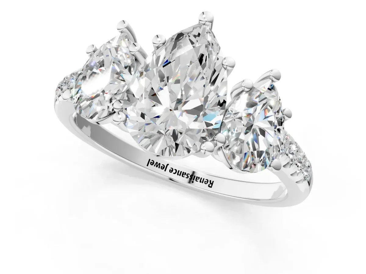 Three-Stone Pear Cut Diamond Ring with Round Pavé Band and Prong Setting White gold