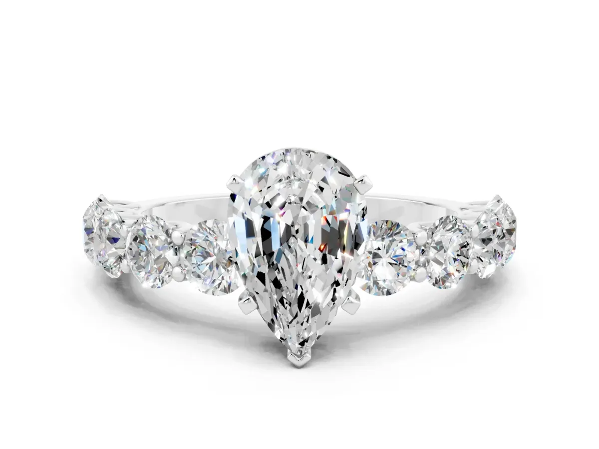 Pear Cut Moissanite Prong Setting with Side Stones on a Pave Band Silver