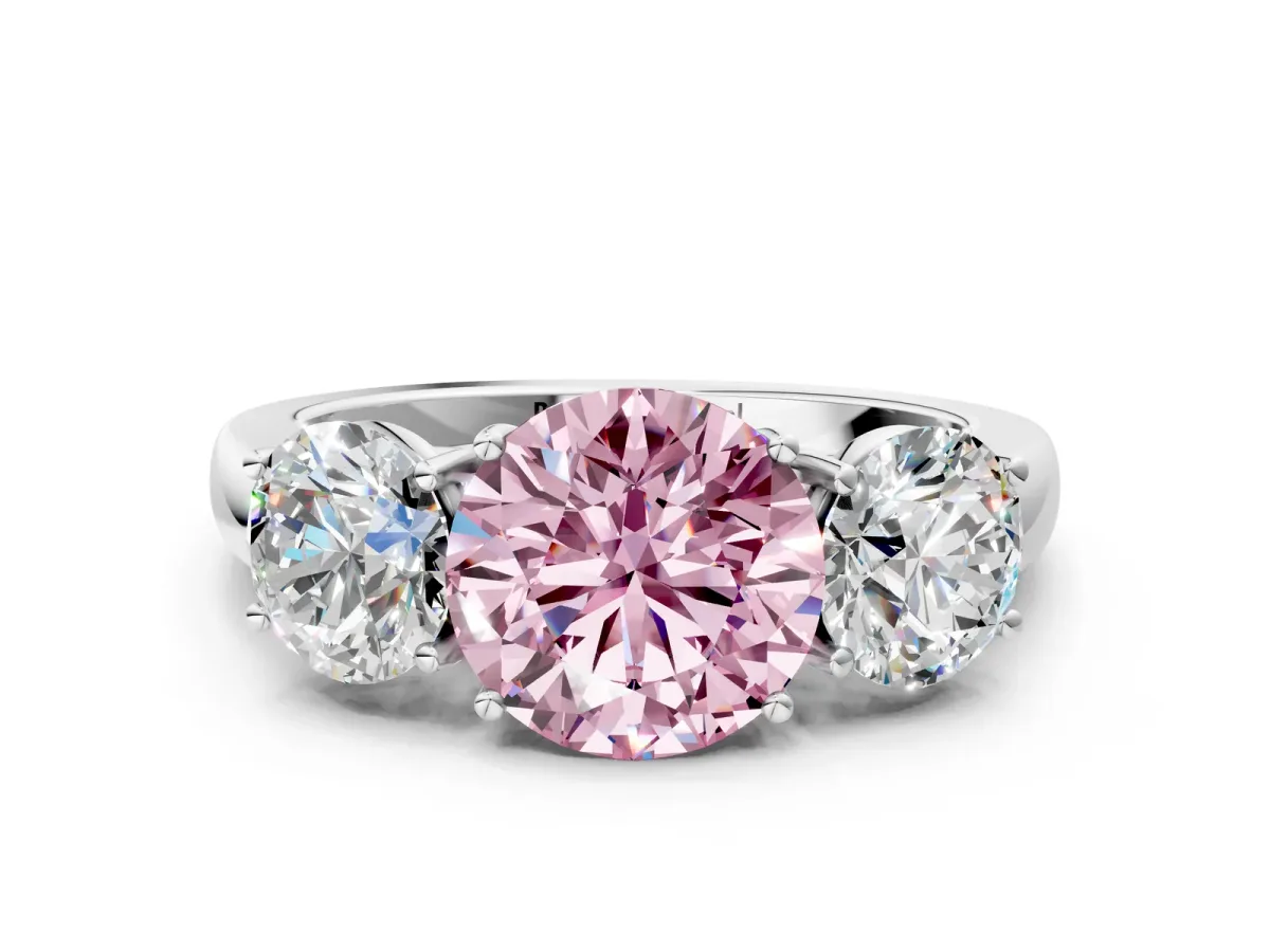 Fancy Pink Round Cut Diamond Three-Stone Ring with Four-Prong Setting and Classic Band Platinum