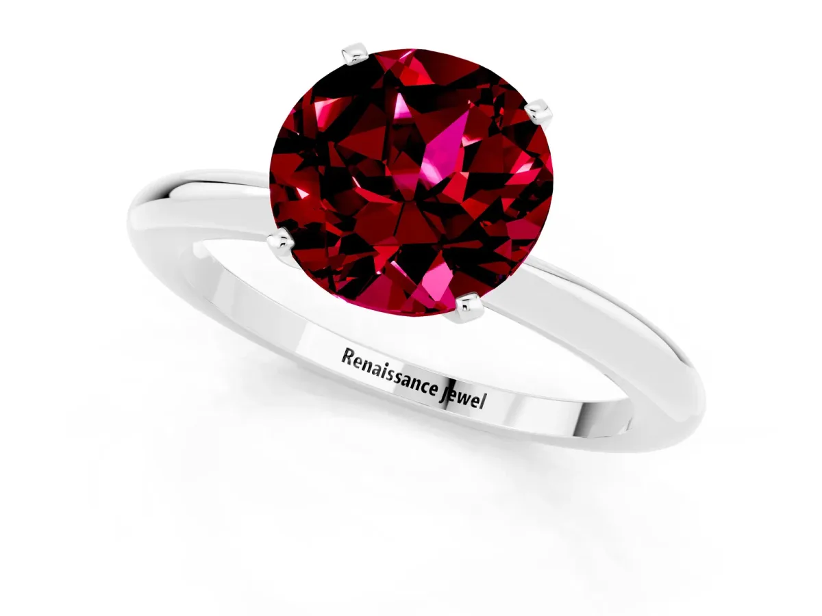 Round Cut Garnet Solitaire Ring with Six-Prong Setting and Classic Band Silver