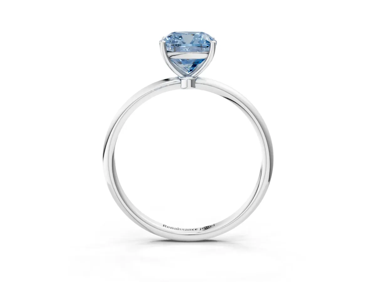 Fancy Blue Cushion Cut Cut Solitaire Engagement Ring with Thin Band and Four-Prong Setting Silver
