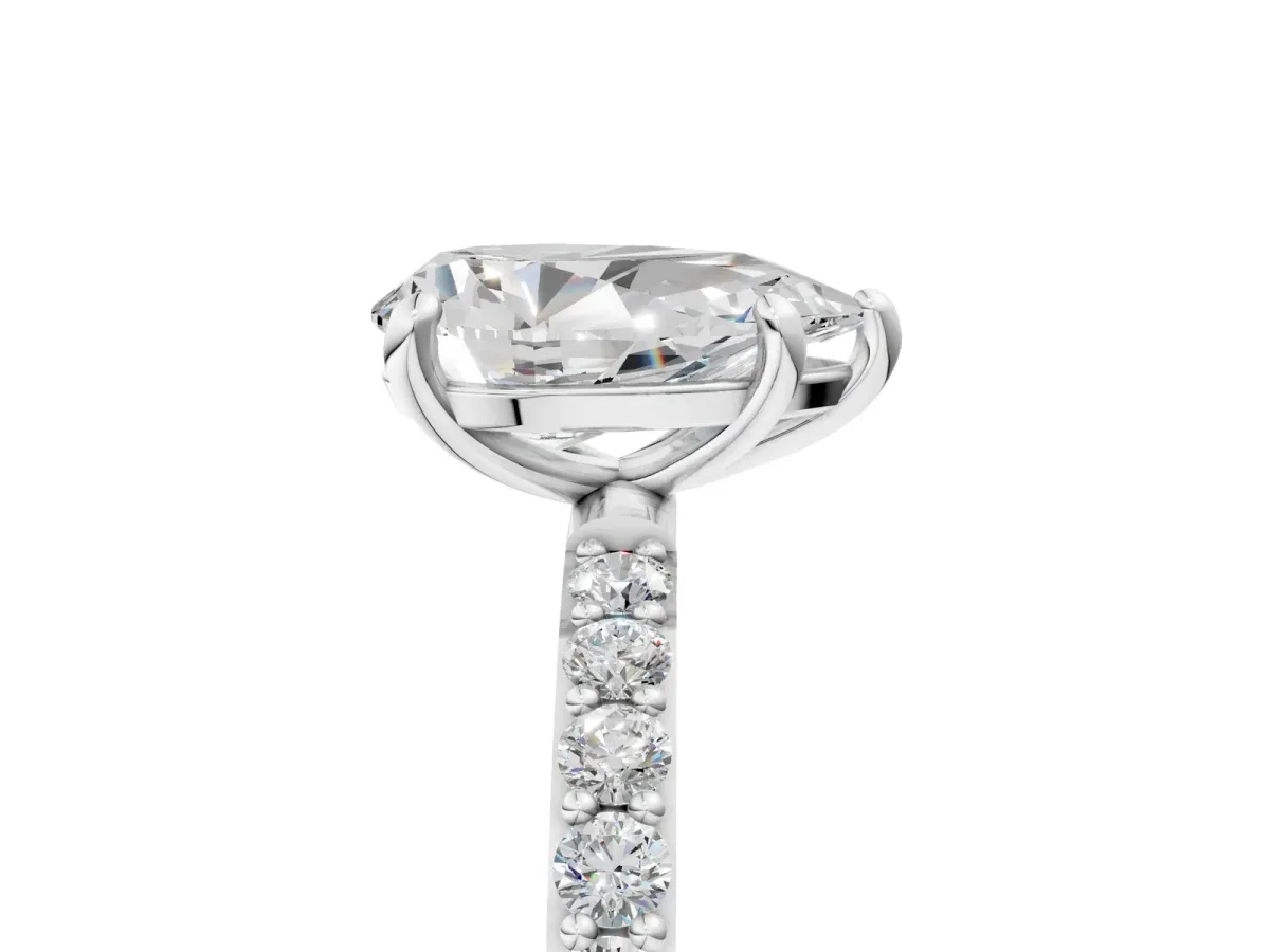 Pear Cut Diamond Solitaire Ring with Round Pavé Band and Prong Setting Platinum