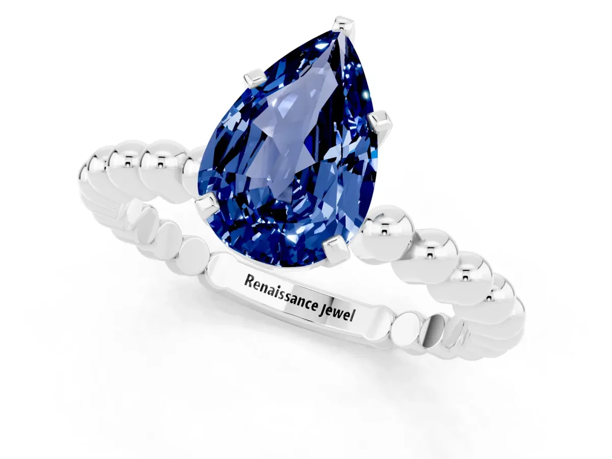 Pear Cut Blue Sapphire Solitaire Ring with Beaded Band and Prong Setting Silver