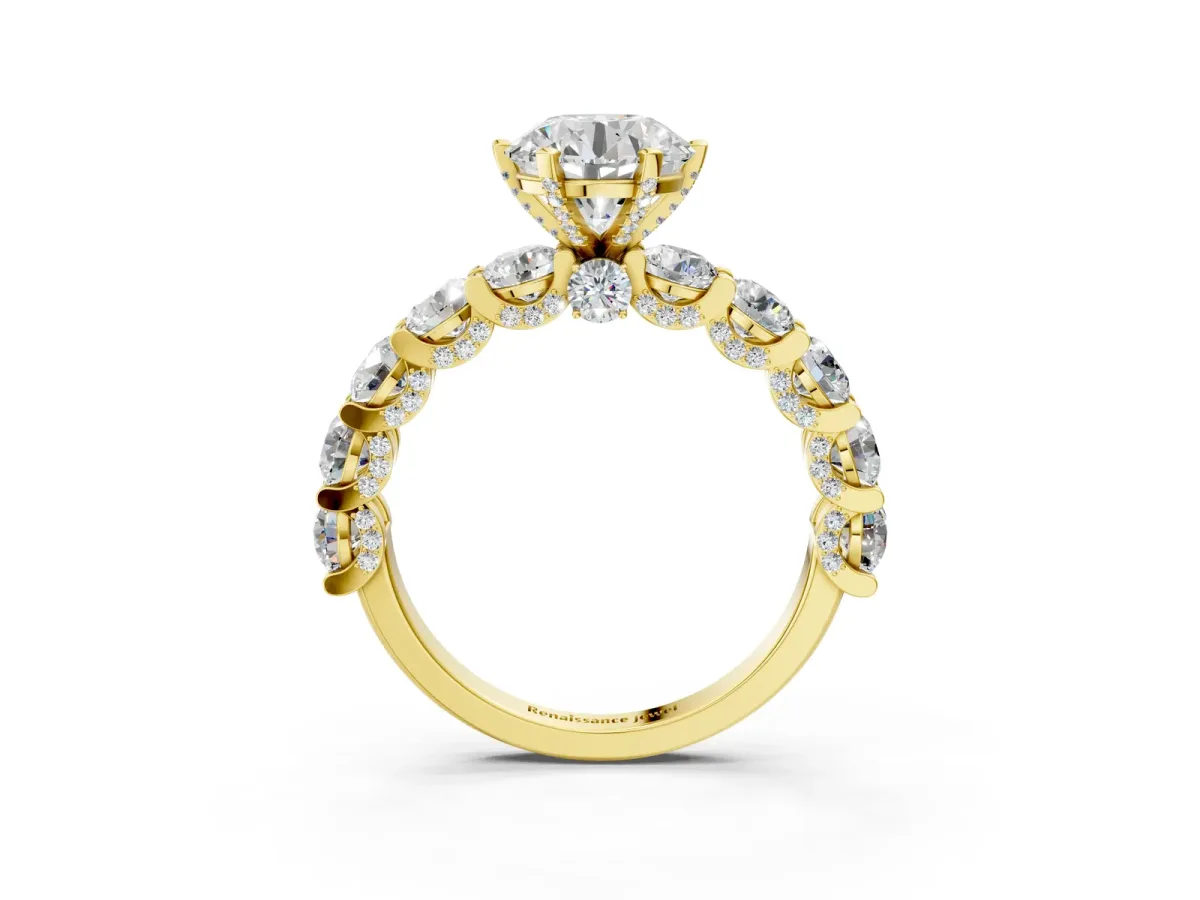 Round Cut Diamond Side Stone Engagement Ring with Four-Prong Setting Yellow gold